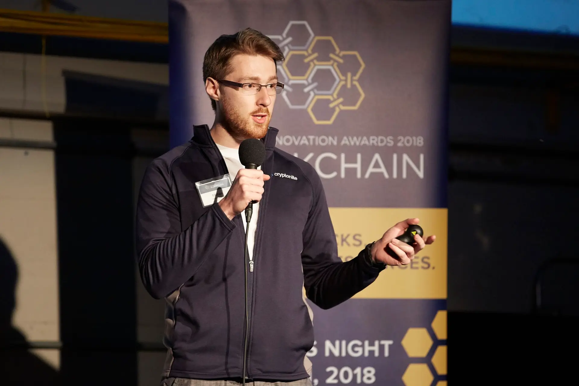 Michael Brenndoefer speaking on stage